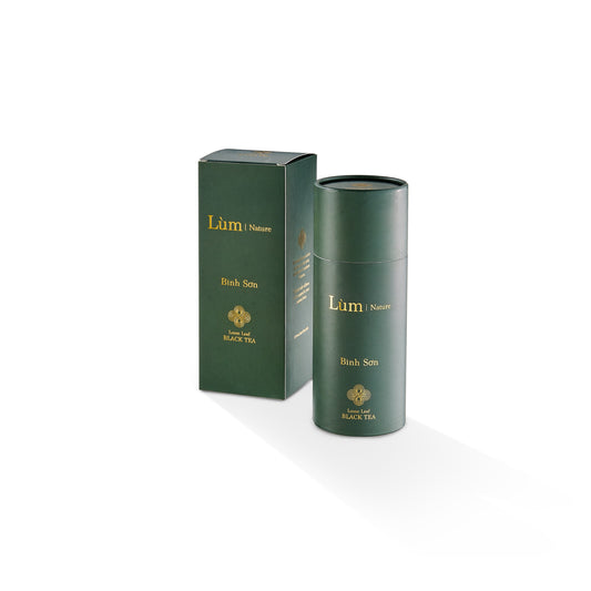 Lùm Nature Binh Son loose leaf black tea tin and box packaging on white background